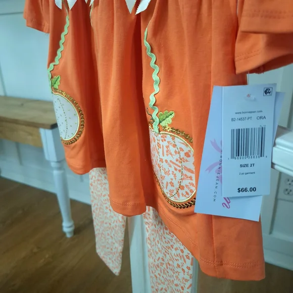Bonnie Jean Orange Pumpkin Tunic with Cream Bows & Printed Leggings - Picture 7 of 9